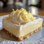No-Bake Lemon Cheesecake Bars – Creamy, Zesty & Oven-Free Delight no-bake lemon cheesecake bars No-bake lemon cheesecake bars topped with whipped cream